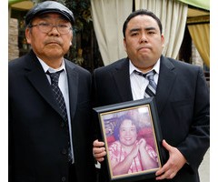 Feb. 4, 2010 file photo shows Jeffrey Uno, right, and his father, Peter Uno, the son and husband of Noriko Uno, in framed photo, who died in an alleged 